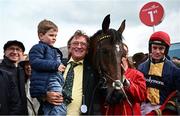 1 May 2024; Owner Sean Mulryan, centre, with his grandson Sean, trainer Martin Brassil, left, and jockey JJ Slevin, right, after sending out Fastorslow to win the Ladbrokes Punchestown Gold Cup during day two of the Punchestown Festival at Punchestown Racecourse in Kildare. Photo by Seb Daly/Sportsfile