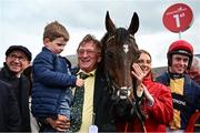 1 May 2024; Owner Sean Mulryan, centre, with his grandson Sean, trainer Martin Brassil, left, and jockey JJ Slevin, right, after sending out Fastorslow to win the Ladbrokes Punchestown Gold Cup during day two of the Punchestown Festival at Punchestown Racecourse in Kildare. Photo by Seb Daly/Sportsfile