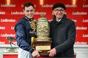 1 May 2024; Jockey JJ Slevin and trainer Martin Brassil with the Punchestown Gold Cup after sending out Fastorslow to win the Ladbrokes Punchestown Gold Cup during day two of the Punchestown Festival at Punchestown Racecourse in Kildare. Photo by Seb Daly/Sportsfile