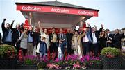 1 May 2024; Owner Sean Mulryan, centre, and winning connections of Fastorslow after winning the Ladbrokes Punchestown Gold Cup during day two of the Punchestown Festival at Punchestown Racecourse in Kildare. Photo by Seb Daly/Sportsfile