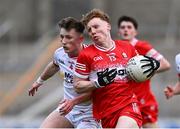 1 May 2024; Niall O'Donnell of Derry in action against Conor Devlin of Tyrone during the EirGrid Ulster GAA U20 Football Championship Final match between Derry and Tyrone at the Box-It Athletic Grounds in Armagh. Photo by Ben McShane/Sportsfile
