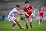 1 May 2024; Shea McCann of Derry in action against Odhran Brolly of Tyrone during the EirGrid Ulster GAA U20 Football Championship Final match between Derry and Tyrone at the Box-It Athletic Grounds in Armagh. Photo by Ben McShane/Sportsfile