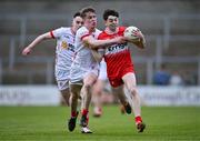 1 May 2024; Shea McCann of Derry in action against James Murray of Tyrone during the EirGrid Ulster GAA U20 Football Championship Final match between Derry and Tyrone at the Box-It Athletic Grounds in Armagh. Photo by Ben McShane/Sportsfile