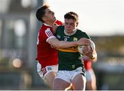 1 May 2024; Eddie Healy of Kerry is tackled by Olan Corcoran of Cork during the EirGrid Munster GAA U20 Football Championship Final match between Kerry and Cork at Austin Stack Park in Tralee, Kerry. Photo by Brendan Moran/Sportsfile