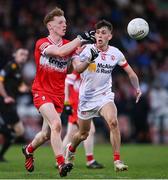 1 May 2024; Niall O'Donnell of Derry in action against Gavin Potter of Tyrone during the EirGrid Ulster GAA U20 Football Championship Final match between Derry and Tyrone at the Box-It Athletic Grounds in Armagh. Photo by Ben McShane/Sportsfile