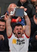 1 May 2024; Tyrone captain Michael Rafferty lifts the Corn Dhónaill Uí Mhurchú cup after the EirGrid Ulster GAA U20 Football Championship Final match between Derry and Tyrone at the Box-It Athletic Grounds in Armagh. Photo by Ben McShane/Sportsfile