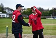 2 May 2024; Captains Mark Adair of Northern Knights and PJ Moor of Munster Reds shake hands before before the Cricket Ireland Inter-Provincial Trophy match between Munster Reds and Northern Knights at Pembroke Cricket Club in Dublin. Photo by Harry Murphy/Sportsfile