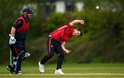 2 May 2024; Curtis Campher of Munster Reds bowls during the Cricket Ireland Inter-Provincial Trophy match between Munster Reds and Northern Knights at Pembroke Cricket Club in Dublin. Photo by Harry Murphy/Sportsfile