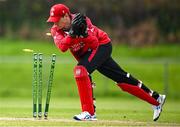 2 May 2024; Munster Reds wicketkeeper PJ Moor runs out Jake Egan of Northern Knights during the Cricket Ireland Inter-Provincial Trophy match between Munster Reds and Northern Knights at Pembroke Cricket Club in Dublin. Photo by Harry Murphy/Sportsfile