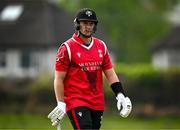 2 May 2024; PJ Moor of Munster Reds walks after being caught out during the Cricket Ireland Inter-Provincial Trophy match between Munster Reds and Northern Knights at Pembroke Cricket Club in Dublin. Photo by Harry Murphy/Sportsfile