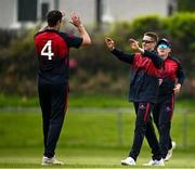 2 May 2024; James McCollum of Northern Knights celebrates with teammate Tom Mayes catching out Brandon Kruger of Munster Reds during the Cricket Ireland Inter-Provincial Trophy match between Munster Reds and Northern Knights at Pembroke Cricket Club in Dublin. Photo by Harry Murphy/Sportsfile