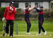 2 May 2024; Mark Adair of Northern Knights celebrates with teammate Ross Adair after bowling out Jordan Neil of Munster Reds during the Cricket Ireland Inter-Provincial Trophy match between Munster Reds and Northern Knights at Pembroke Cricket Club in Dublin. Photo by Harry Murphy/Sportsfile