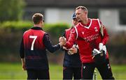2 May 2024; Ben White of Munster Reds shakes hands with James McCollum of Northern Knights after the Cricket Ireland Inter-Provincial Trophy match between Munster Reds and Northern Knights at Pembroke Cricket Club in Dublin. Photo by Harry Murphy/Sportsfile