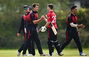 2 May 2024; Tom Mayes of Northern Knights and Mike Frost of Munster Reds shake hands after the Cricket Ireland Inter-Provincial Trophy match between Munster Reds and Northern Knights at Pembroke Cricket Club in Dublin. Photo by Harry Murphy/Sportsfile