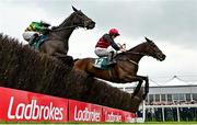 2 May 2024; Pinkerton, right, with Sam Ewing up, jumps the last on their way to winning the Frontline Security Handicap Steeplechase, from eventual second place Saint Roi, left, with Aidan Kelly up, during day three of the Punchestown Festival at Punchestown Racecourse in Kildare. Photo by Seb Daly/Sportsfile