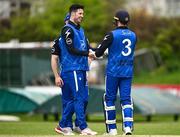 2 May 2024; George Dockrell of Leinster Lightning celebrates with teammate Lorcan Tucker after taking the wicket of Kian Hilton of North West Warriors during the Cricket Ireland Inter-Provincial Trophy match between Leinster Lightning and North West Warriors at Pembroke Cricket Club in Dublin. Photo by Harry Murphy/Sportsfile