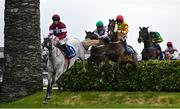 2 May 2024; Coko Beach, left, with Jack Kennedy up, jumps the Glendalough Drop Hedge on their way to finishing third in the Mongey Communications La Touche Cup Cross Country Steeplechase, from eventual winner Singing Banjo, right, with Barry Walsh up, during day three of the Punchestown Festival at Punchestown Racecourse in Kildare. Photo by Seb Daly/Sportsfile