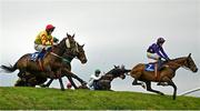 2 May 2024; Singing Banjo, left, with Barry Walsh up, jumps Ruby's Double on their way to winning the Mongey Communications La Touche Cup Cross Country Steeplechase during day three of the Punchestown Festival at Punchestown Racecourse in Kildare. Photo by Seb Daly/Sportsfile