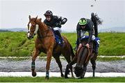 2 May 2024; Jockey Rob James and El Paso Wood, right, narrowly avoid falling after clearing Ruby's Double during the Mongey Communications La Touche Cup Cross Country Steeplechase on day three of the Punchestown Festival at Punchestown Racecourse in Kildare. Photo by Seb Daly/Sportsfile