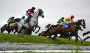 2 May 2024; Singing Banjo, right, with Barry Walsh up, jumps Ruby's Double on their way to winning the Mongey Communications La Touche Cup Cross Country Steeplechase during day three of the Punchestown Festival at Punchestown Racecourse in Kildare. Photo by Seb Daly/Sportsfile