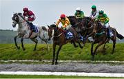 2 May 2024; Singing Banjo, centre, with Barry Walsh up, jumps Ruby's Double on their way to winning the Mongey Communications La Touche Cup Cross Country Steeplechase during day three of the Punchestown Festival at Punchestown Racecourse in Kildare. Photo by Seb Daly/Sportsfile