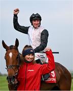2 May 2024; Jockey Jack Kennedy celebrates with groom Erika Peciulyte after riding Teahupoo to victory in the Ladbrokes Champion Stayers Hurdle during day three of the Punchestown Festival at Punchestown Racecourse in Kildare. Photo by Seb Daly/Sportsfile