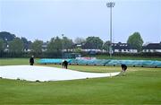 3 May 2024; The covers are brought on to protect the pitch during a rain shower before the Cricket Ireland Inter-Provincial Trophy match between North West Warriors and Munster Reds at Pembroke Cricket Club in Dublin. Photo by Piaras Ó Mídheach/Sportsfile