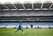 3 May 2024; Jamison Gibson-Park kicks a gaelic football during a Leinster Rugby captain's run at Croke Park in Dublin. Photo by Harry Murphy/Sportsfile