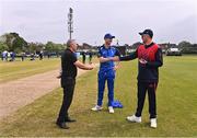 3 May 2024; Umpire Graham McCrea with team captains George Dockrell of Leinster Lightning, left, and Mark Adair of Northern Knights for the coin toss before the Cricket Ireland Inter-Provincial Trophy match between Leinster Lightning  and Northern Knights at Pembroke Cricket Club in Dublin. Photo by Piaras Ó Mídheach/Sportsfile