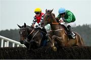 3 May 2024; Private Ryan, right, with Jamie Scallan up, jumps the last on their way to winning the Stanley Asphalt Hunters Steeplechase for the Bishopscourt Cup, from eventual second place De Nordener, left, with Toni Quail up, during day four of the Punchestown Festival at Punchestown Racecourse in Kildare. Photo by Seb Daly/Sportsfile
