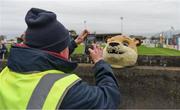 3 May 2024; Stadium steward Aidan Donnellan takes a photo of Galway United mascot ‘Terry The Tiger’ before the SSE Airtricity Men's Premier Division match between Galway United and Derry City at Eamonn Deacy Park in Galway. Photo by Tom Beary/Sportsfile