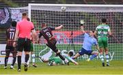 3 May 2024; Filip Piszczek of Bohemians shoots to score his side's first goal past Shamrock Rovers goalkeeper Leon Pohls during the SSE Airtricity Men's Premier Division match between Bohemians and Shamrock Rovers at Dalymount Park in Dublin. Photo by Stephen McCarthy/Sportsfile