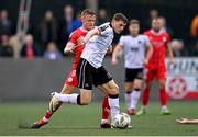 3 May 2024; Zak Bradshaw of Dundalk in action against JJ Lunney of Shelbourne during the SSE Airtricity Men's Premier Division match between Dundalk and Shelbourne at Oriel Park in Dundalk, Louth. Photo by Ben McShane/Sportsfile