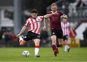 3 May 2024; Adam O'Reilly of Derry City has a shot at goal under pressure from Stephen Walsh of Galway United during the SSE Airtricity Men's Premier Division match between Galway United and Derry City at Eamonn Deacy Park in Galway. Photo by Tom Beary/Sportsfile