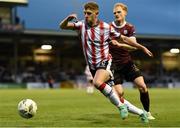 3 May 2024; Ronan Boyce of Derry City in action against Vincent Borden of Galway United during the SSE Airtricity Men's Premier Division match between Galway United and Derry City at Eamonn Deacy Park in Galway. Photo by Tom Beary/Sportsfile