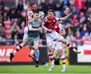 3 May 2024; Warren Davis of Drogeda United in action against Brandon Kavanagh, right, and Ryan McLaughlin of St Patrick's Athletic, behind, during the SSE Airtricity Men's Premier Division match between St Patrick's Athletic and Drogheda United at Richmond Park in Dublin. Photo by Shauna Clinton/Sportsfile