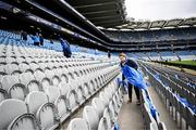 4 May 2024; Leinster supporter Sandra Delaney places flags in the Cusack stand before the Investec Champions Cup semi-final match between Leinster and Northampton Saints at Croke Park in Dublin. Photo by Harry Murphy/Sportsfile