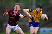 4 May 2024; Shane McGinley of Roscommon in action against Shane Canavan of Galway during the Connacht GAA Football U20 Championship final match between Roscommon and Galway at Hastings Insurance MacHale Park in Castlebar, Mayo. Photo by Ben McShane/Sportsfile