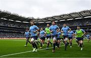 4 May 2024; Leinster captain Caelan Doris, left, leads his team during the warm-up before the Investec Champions Cup semi-final match between Leinster and Northampton Saints at Croke Park in Dublin. Photo by Harry Murphy/Sportsfile
