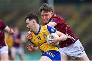 4 May 2024; Shane McGinley of Roscommon is tackled by Shane Canavan of Galway during the Connacht GAA Football U20 Championship final match between Roscommon and Galway at Hastings Insurance MacHale Park in Castlebar, Mayo. Photo by Ben McShane/Sportsfile