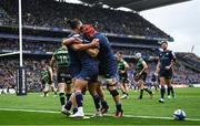 4 May 2024; James Lowe of Leinster, left, celebrates with teammates Jamison Gibson-Park, centre, and Josh van der Flier after scoring their side's first try during the Investec Champions Cup semi-final match between Leinster and Northampton Saints at Croke Park in Dublin. Photo by Harry Murphy/Sportsfile
