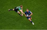 4 May 2024; Jamison Gibson-Park of Leinster evades the tackle of Northampton Saints' Fin Smith during the Investec Champions Cup semi-final match between Leinster and Northampton Saints at Croke Park in Dublin. Photo by Stephen McCarthy/Sportsfile