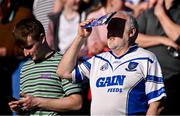 4 May 2024; A Waterford supporter uses a match programme to shield his eyes from the sun at the Munster GAA Hurling Senior Championship Round 3 match between Waterford and Tipperary at Walsh Park in Waterford. Photo by Piaras Ó Mídheach/Sportsfile