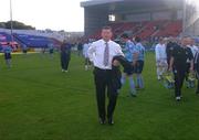 29 July 2004; Newly appointed Dublin City FC manager Roddy Collins makes his way to the dugout before the game. eircom League, Premier Division, Dublin City v St. Patrick's Athletic, Tolka Park, Dublin. Picture credit; Brian Lawless / SPORTSFILE