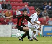 29 July 2004; Dean Fitzgearld, Longford Town, is tackled by Michele Polverino, FC Vaduz. UEFA Cup, 1st Qualifying Round, 2nd Leg, Longford Town v FC Vaduz, Flancare Park, Longford. Picture credit; Ray McManus / SPORTSFILE