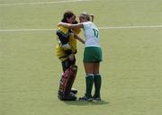 30 July 2004; Ireland's Kirsty McCollum (17) consoles her team-mate Alison Lappin after defeat to Belarus. European Hockey Junior Championship, Cross Over Match, Ireland v Belarus, UCD, Belfield, Dublin. Picture credit; Brian Lawless / SPORTSFILE