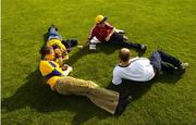 31 July 2004; Dejected Clare supporters relax on the pitch after the game. Guinness All-Ireland Hurling Championship Quarter Final Replay, Clare v Kilkenny, Semple Stadium, Thurles, Co. Tipperary. Picture credit; Ray McManus / SPORTSFILE