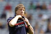 25 July 2004; Cork manager Donal O'Grady adjusts his head-set before the match. Guinness All-Ireland Senior Hurling Championship, Quarter Final, Antrim v Cork, Croke Park, Dublin. Picture credit; Brian Lawless / SPORTSFILE