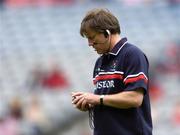 25 July 2004; Cork manager Donal O'Grady adjusts his head-set before the game. Guinness All-Ireland Senior Hurling Championship, Quarter Final, Antrim v Cork, Croke Park, Dublin. Picture credit; Brian Lawless / SPORTSFILE