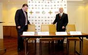 4 August 2004; Fran Rooney, Chief Executive Officer, Football Association of Ireland, left, and David Chick, Chairman, Senior Clubs Committee, Irish Football Association, take their seats for a press conference where the FAI and IFA formally launched an All Ireland Club Tournament. Fitzwilliam Hotel, St Stephens Green, Dublin. Picture credit; Ray McManus / SPORTSFILE
